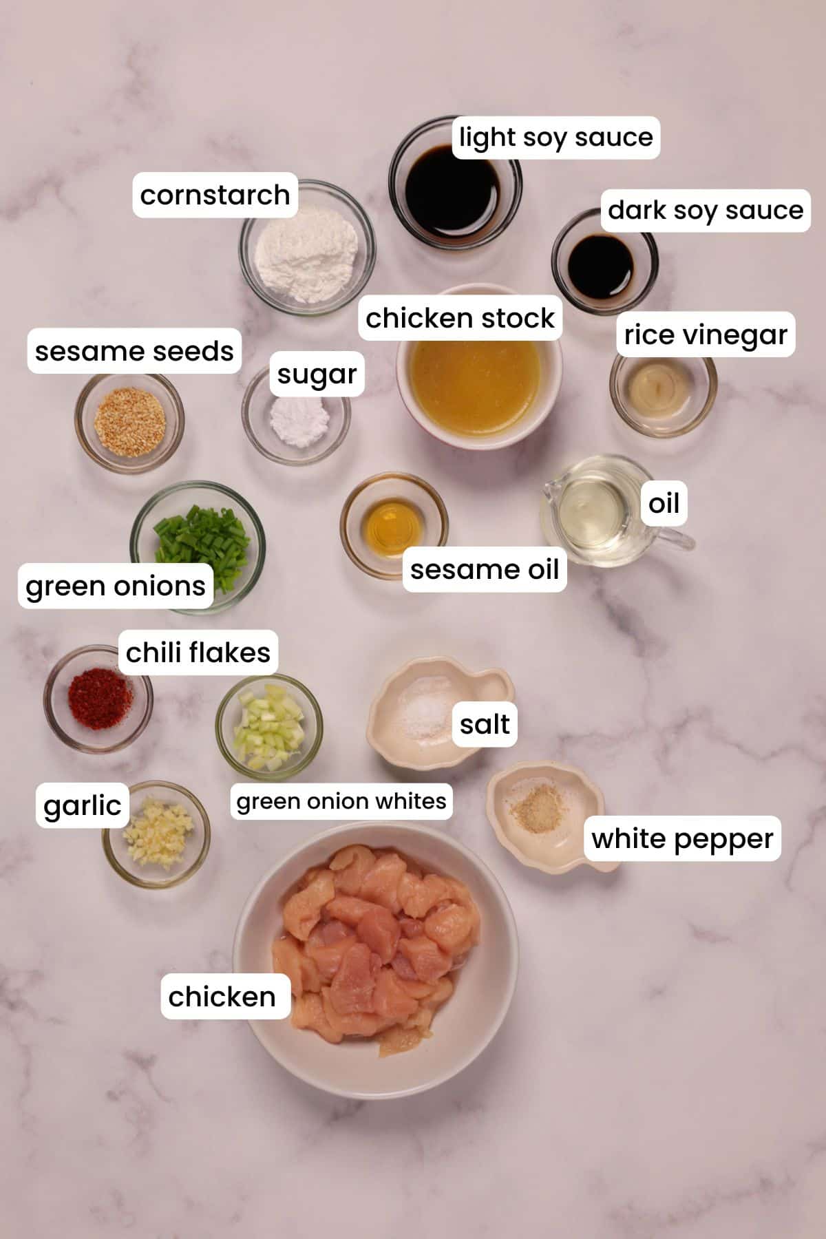 Ingredients for making Chinese garlic chicken on a white background.