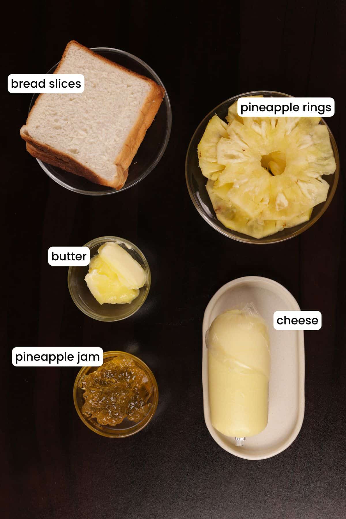 Ingredients for Quick Pineapple Sandwich: white bread, pineapple rings, butter, pineapple jam, and grated cheese.