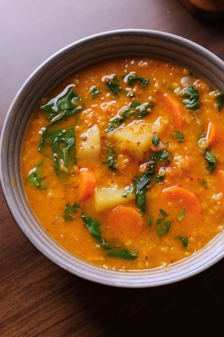 Healthy Mediterranean-style lentil soup with carrots, celery, and spices.