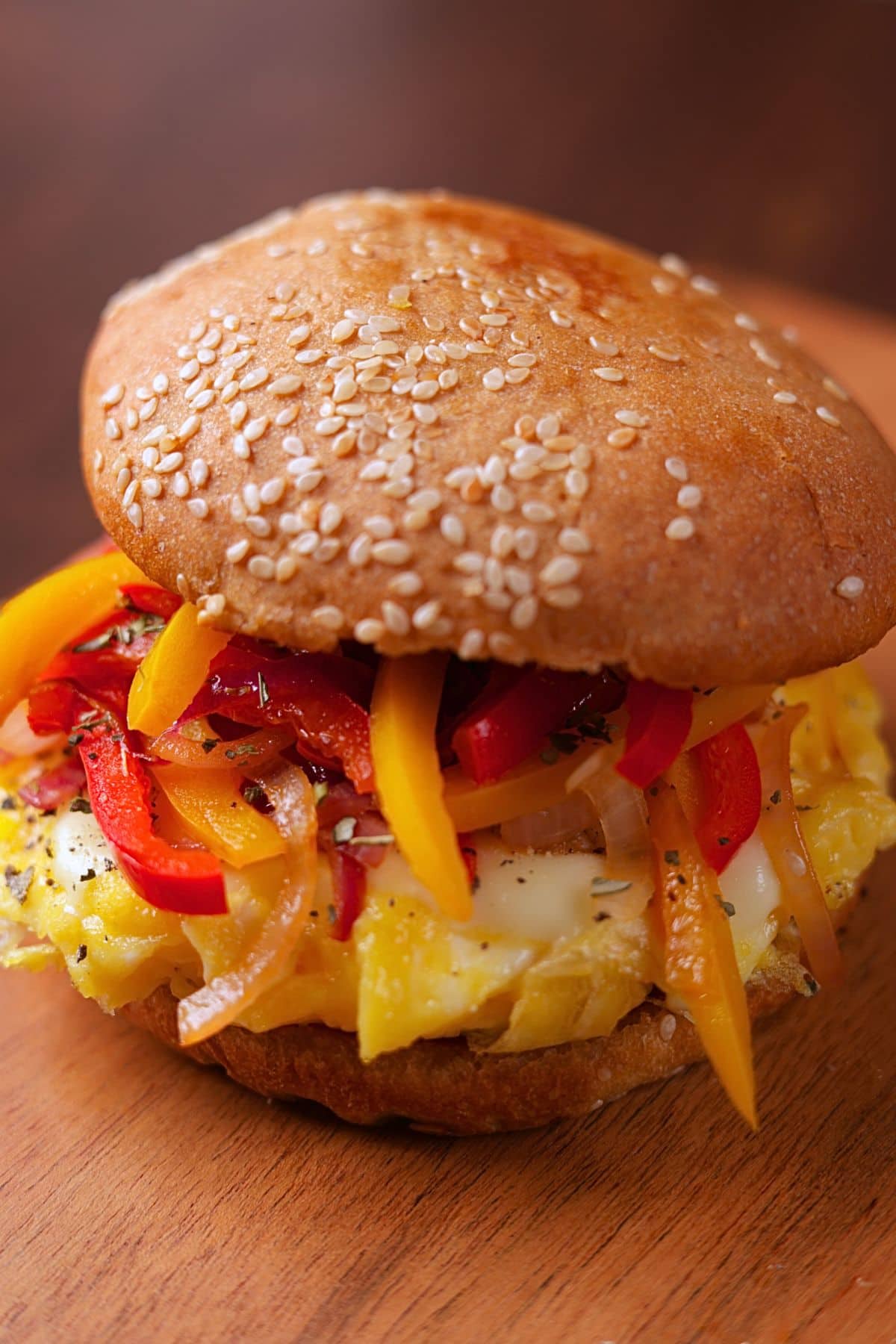 Served Pepper and Egg Sandwich with soft scrambled eggs, melty cheese, and sautéed peppers and onions on a lightly butter-toasted bun.