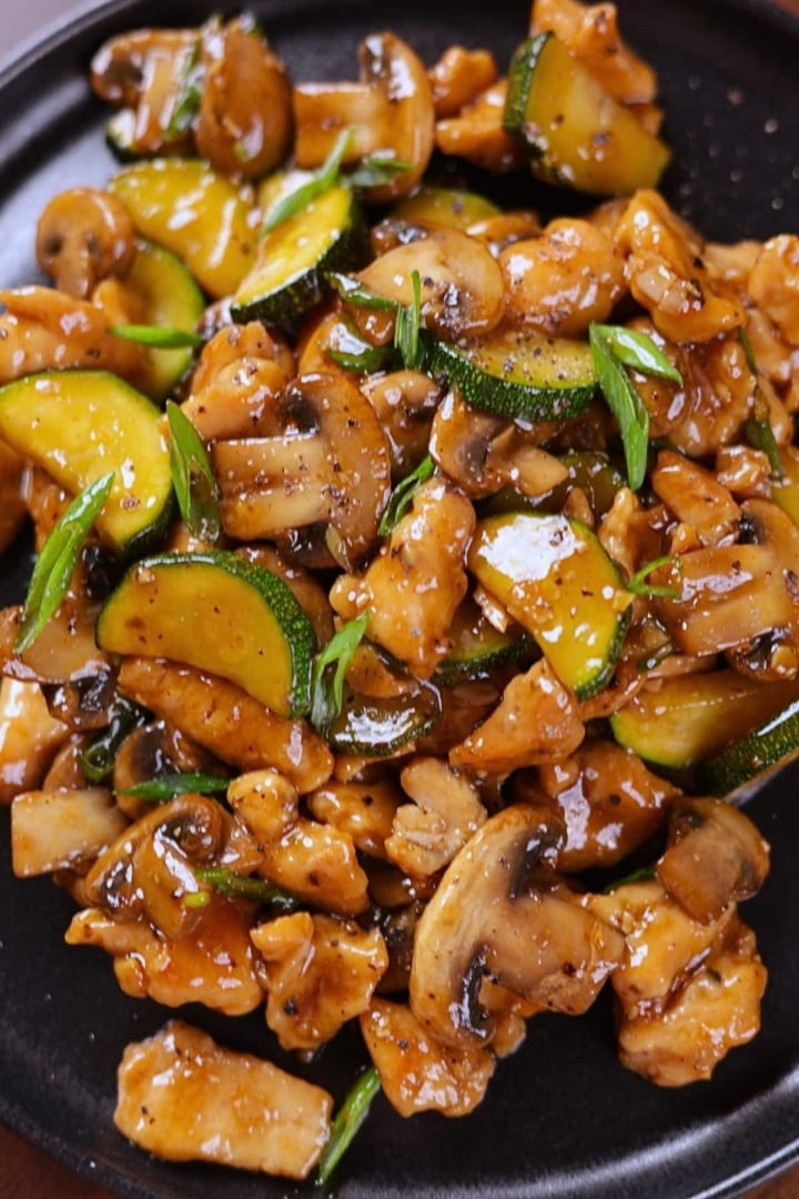 Panda Express Mushroom Chicken Copycat served on a black plate, ready to eat.