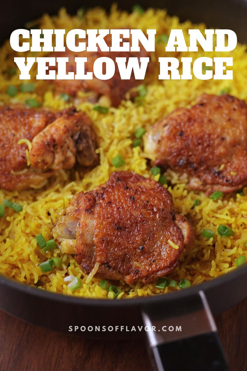 Easy one pan chicken and yellow rice with four chicken thighs in a skillet.