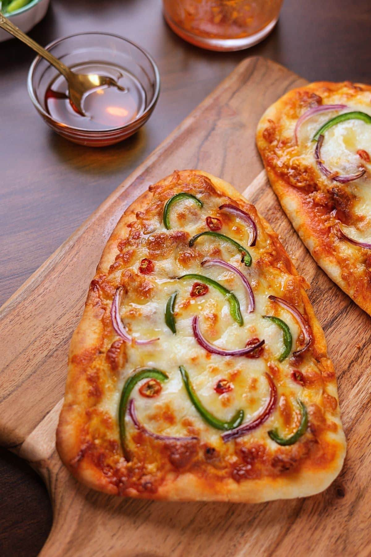 Freshly baked buffalo chicken flatbread pizza ready to serve.
