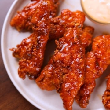 Honey sriracha chicken tenders served with ranch dipping sauce.