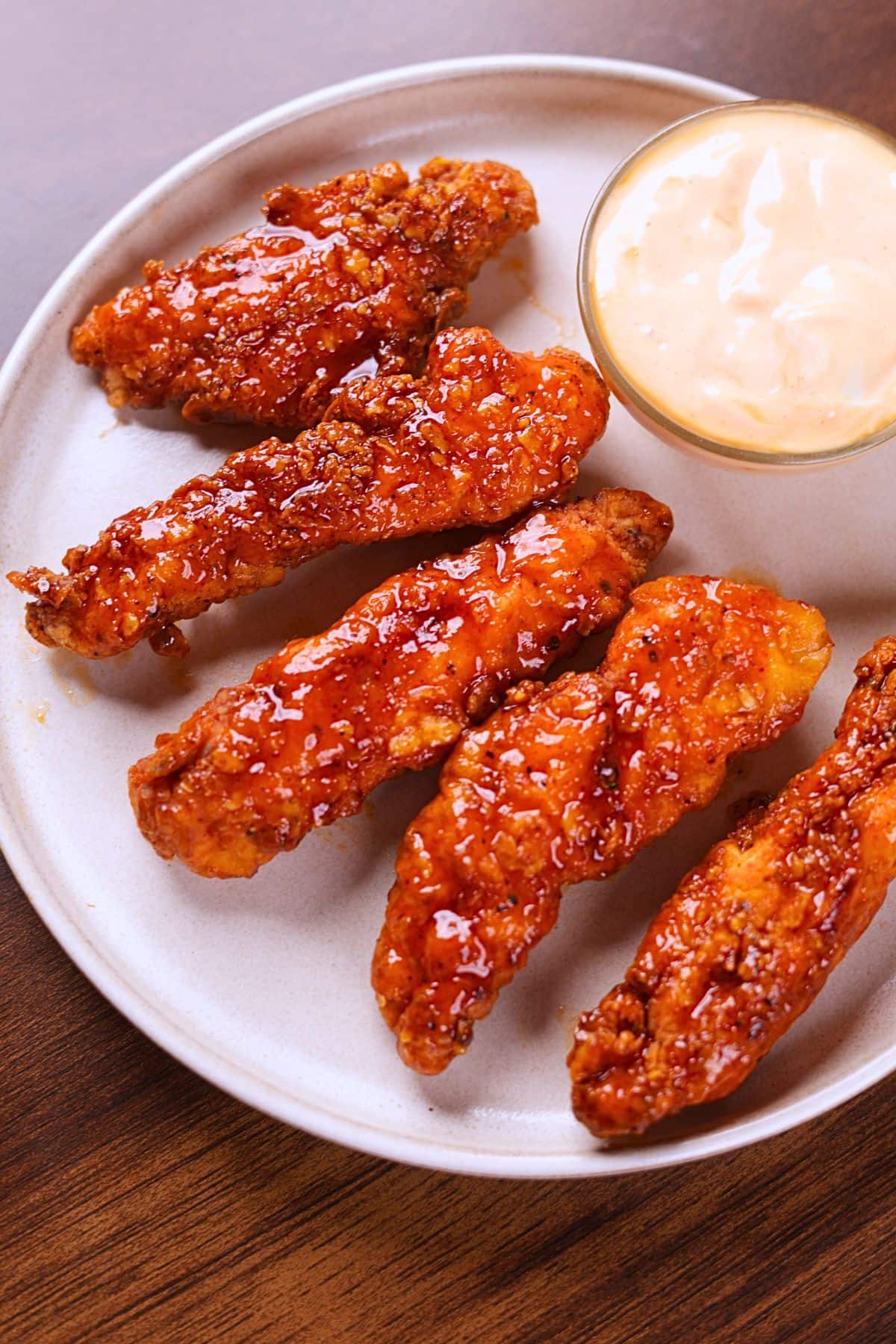 Crispy honey sriracha chicken tenders served with ranch dipping sauce.