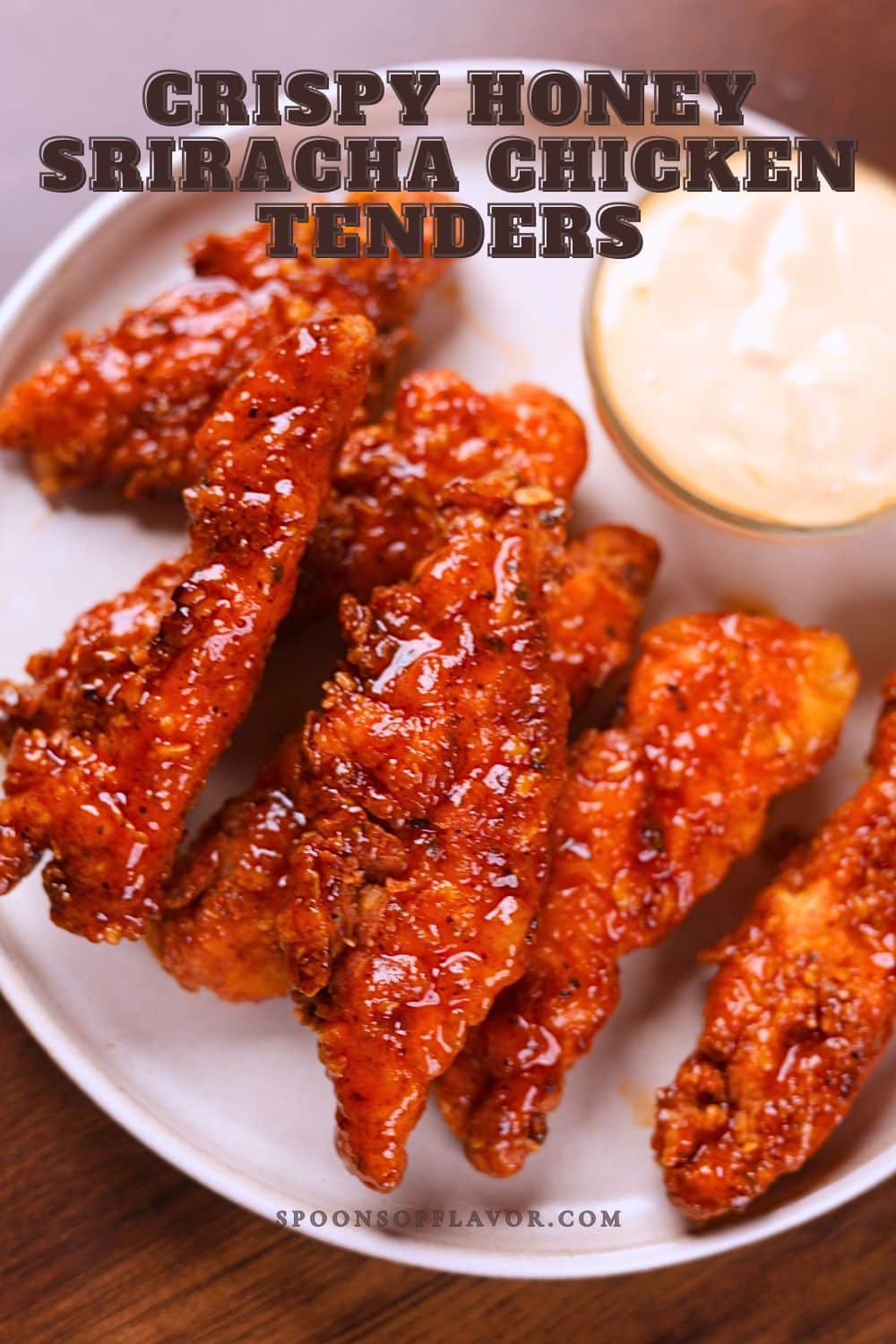 Honey sriracha chicken tenders served with ranch sauce.