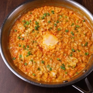 Creamy buldak ramen in a pan.