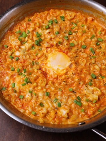 Creamy buldak ramen in a pan.