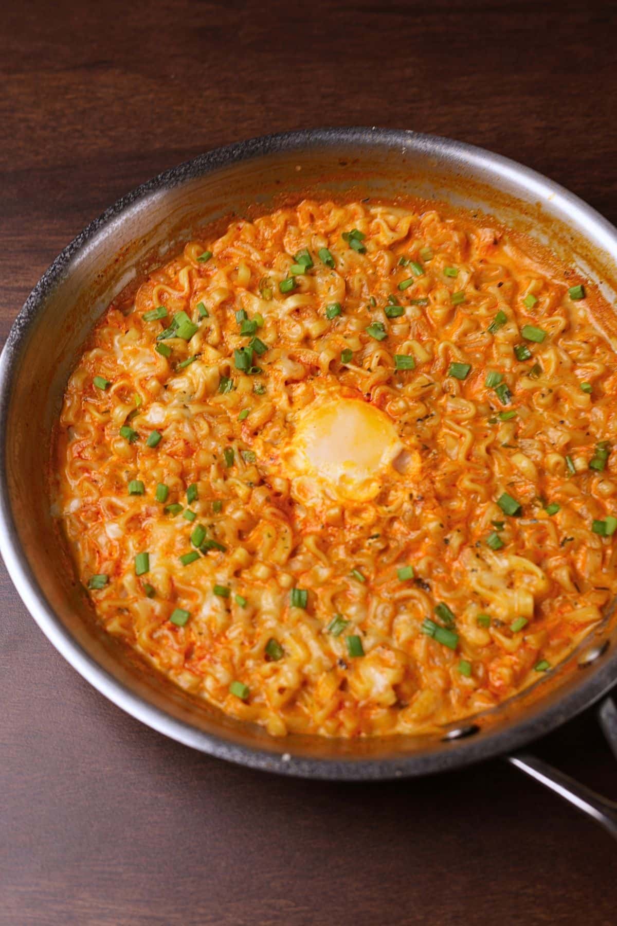 Creamy buldak ramen in a pan.