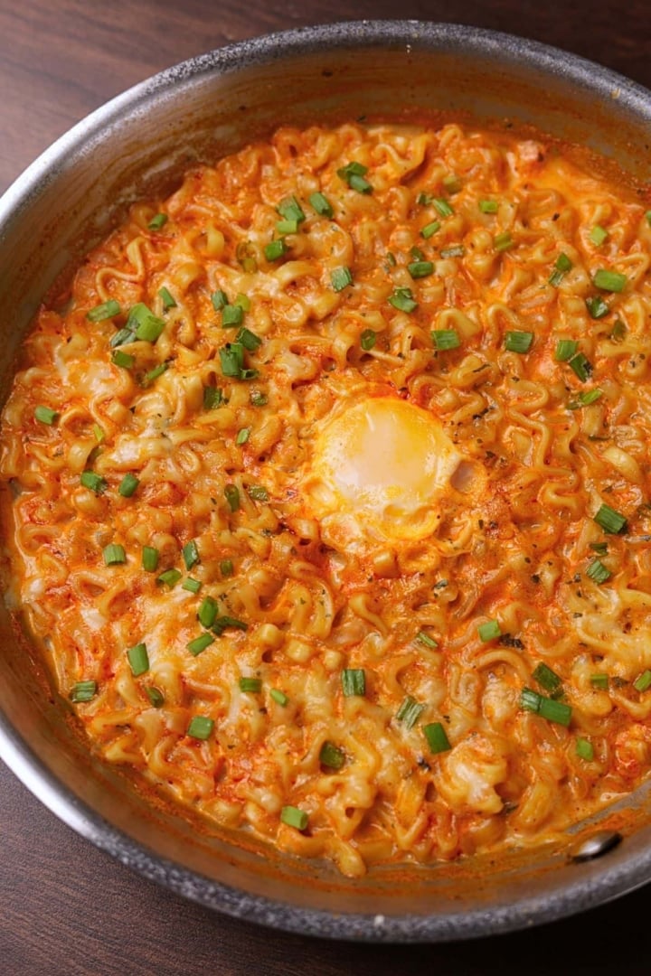 Creamy buldak ramen in a pan.