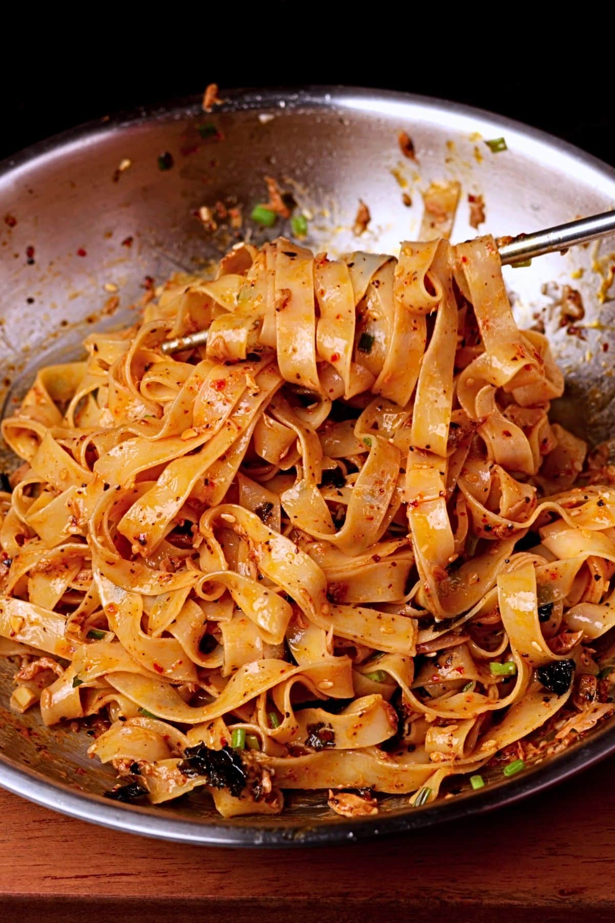 Tuna noodles with canned tuna and creamy sauce in a pan.