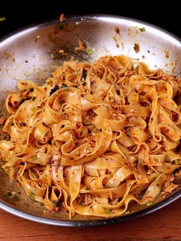 15-minute tuna noodles with canned tuna and creamy sauce in a pan.