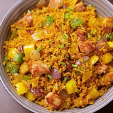 Curry chicken fried rice served in a bowl.